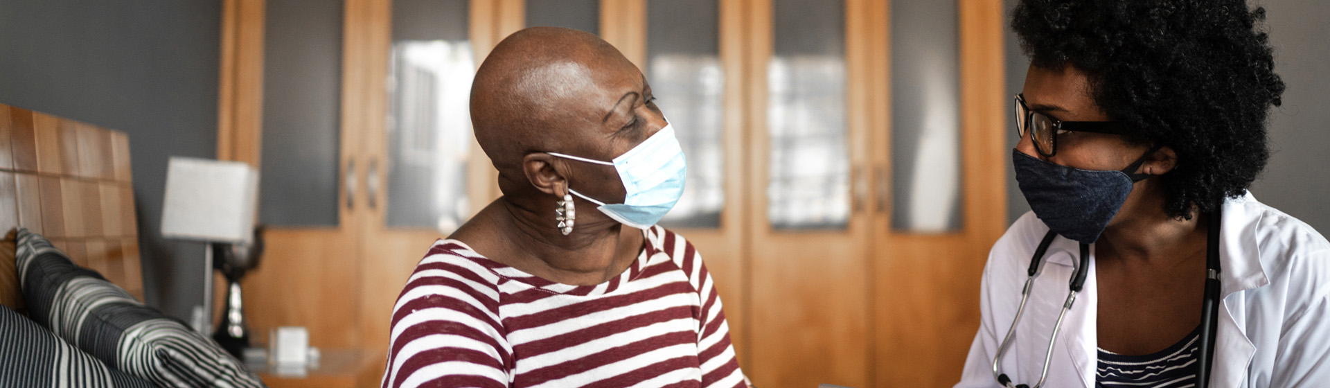 Provider speaking with patient in community health center room