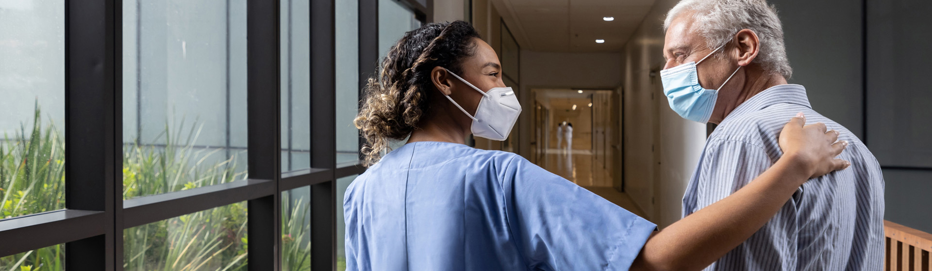 Nurse Walking with Senior Patient